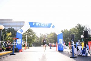OrthoBethesda-5K-Runner-Crossing-Finish-Line