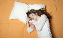 woman sleeping on bed