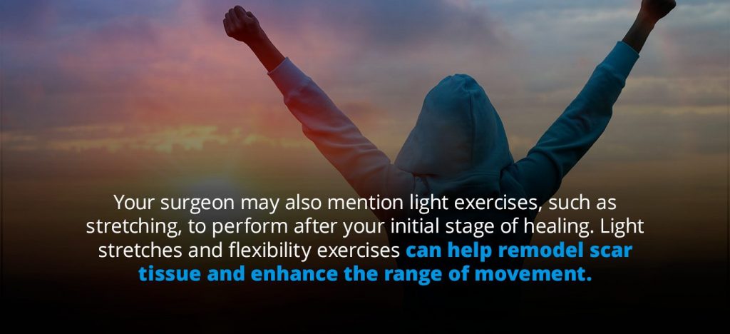 person stretching in front of sunrise